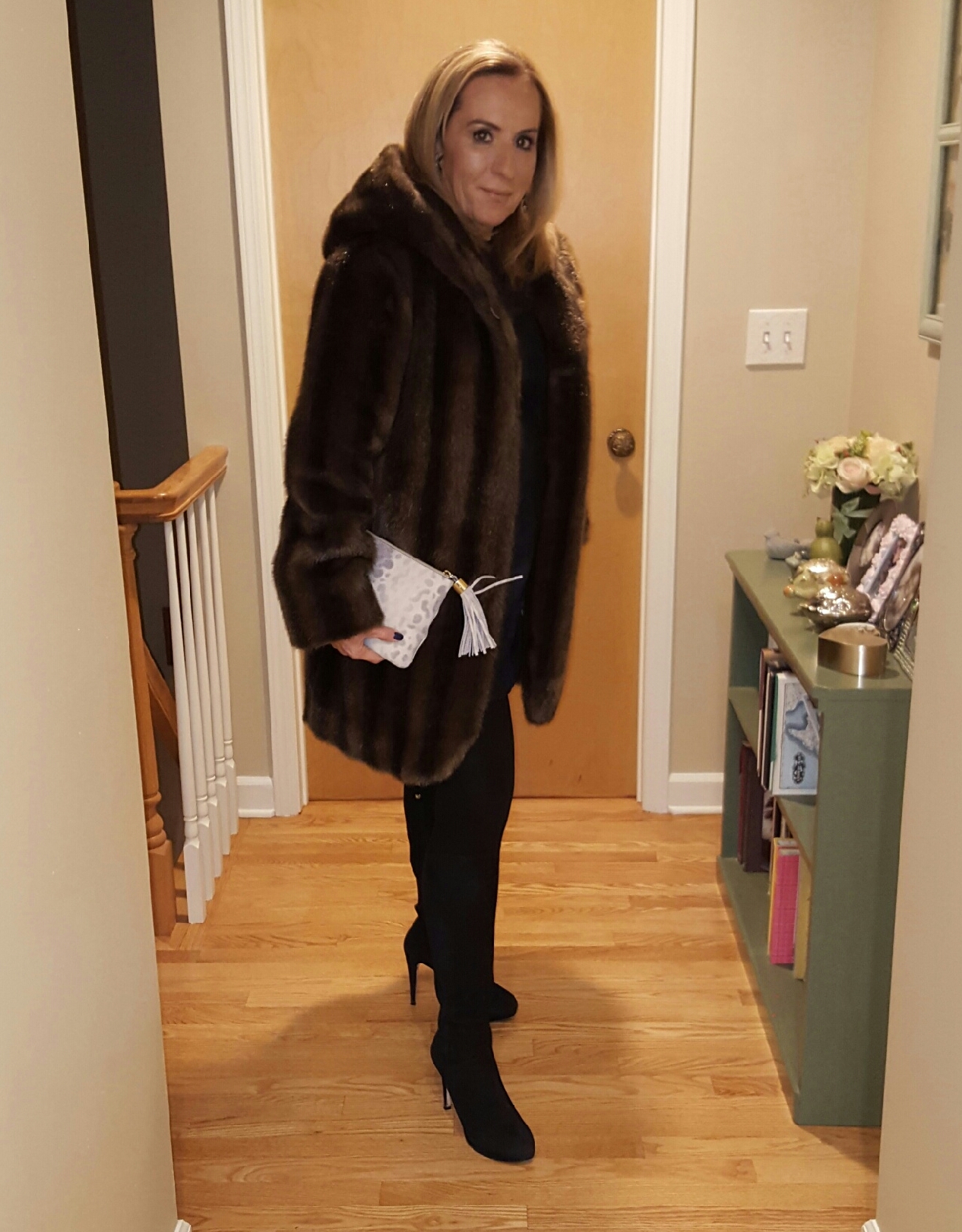 Fuax fur coat over black leather mini dress. - followPhyllis